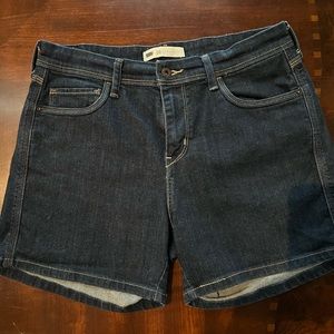 Levi’s denim shorts. Size 10. 14 1/2” from waist to hem. Excellent condition.